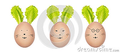 Easter bunnies made of henâ€™s eggs and green salad leaves. Funny bunny faces drawn on the eggs. Creative Easter decoration. Stock Photo